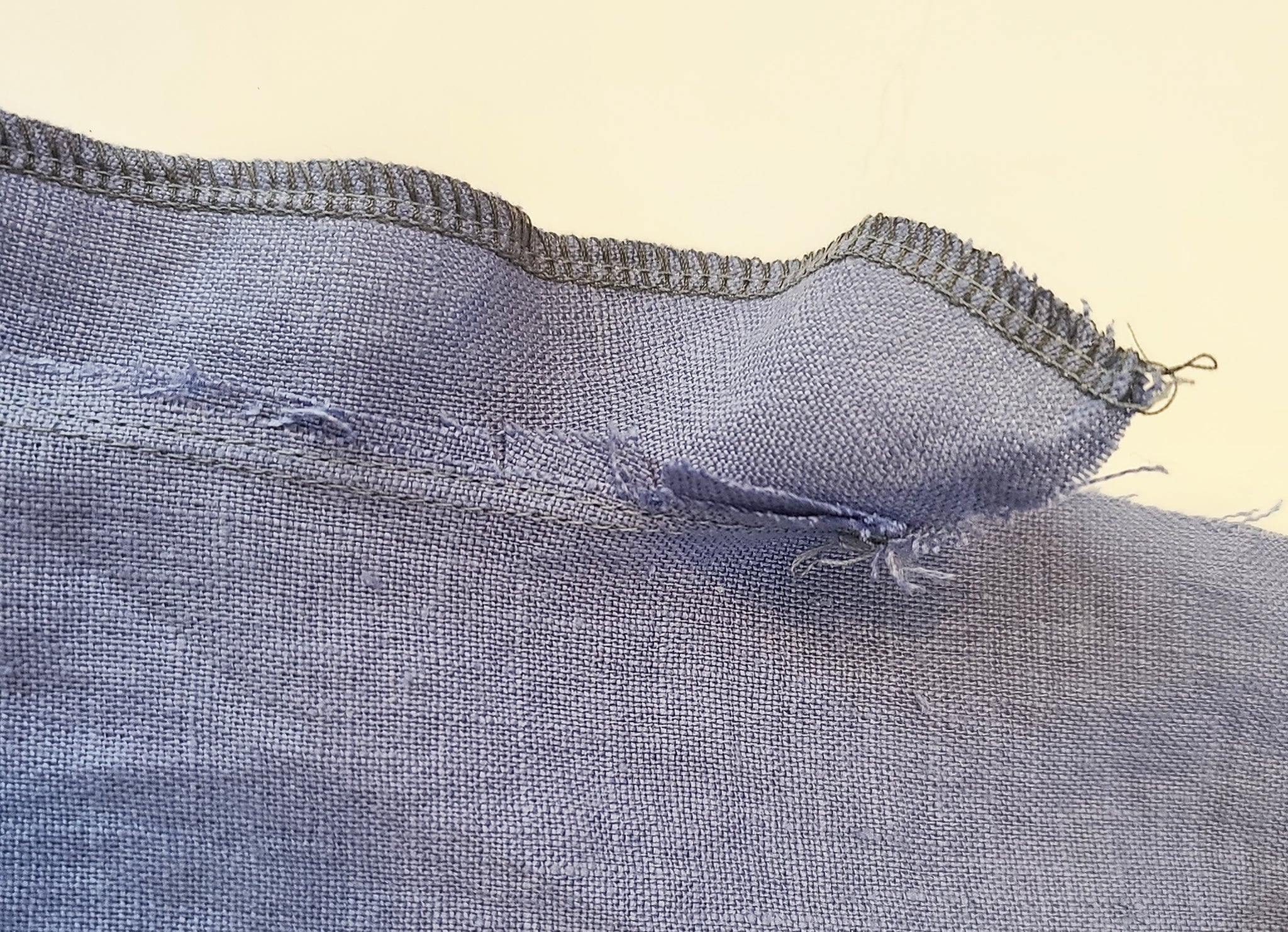 Pocket facing understitching from the back