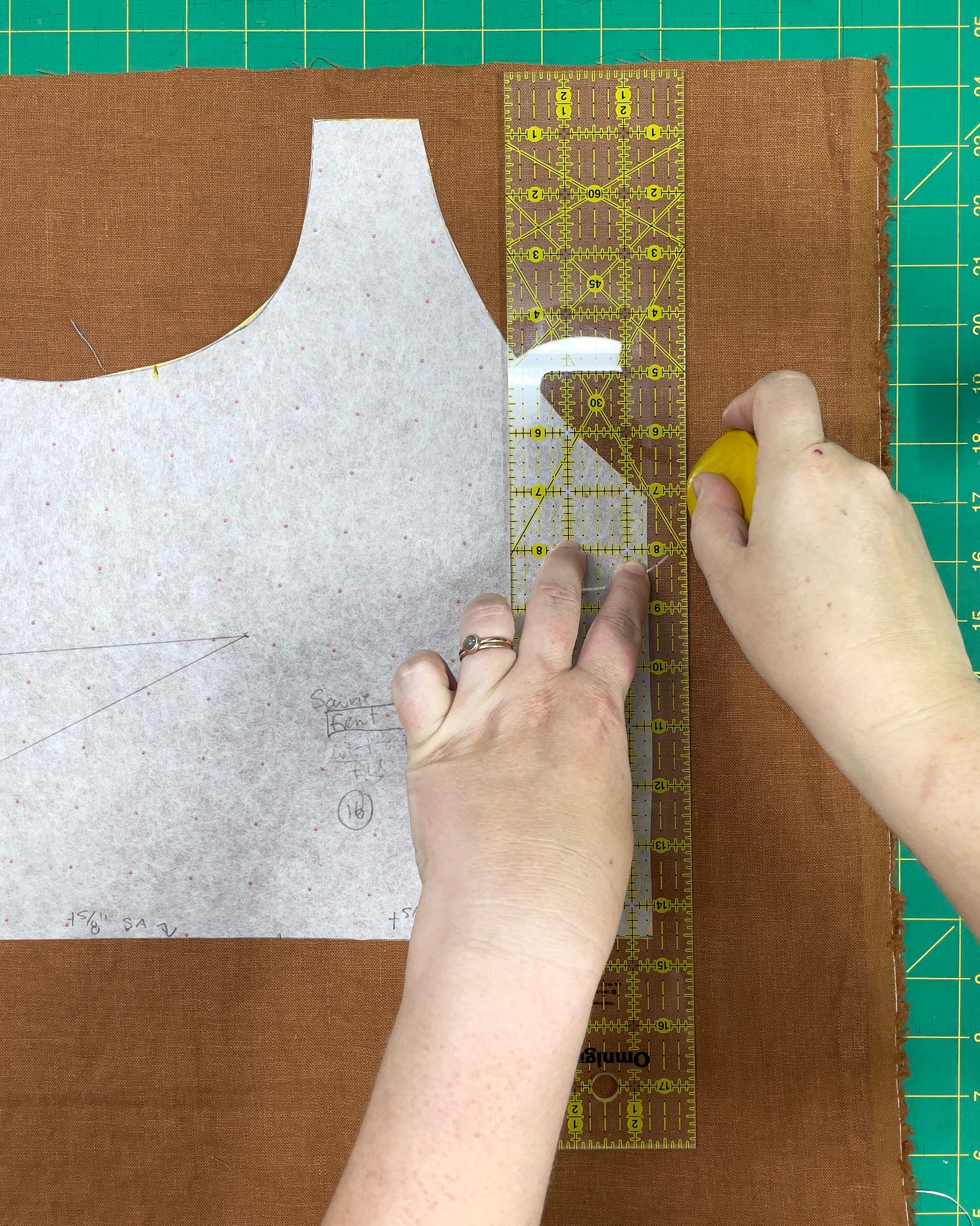 Marking the seam allowance and cutting lines for the front bodice pattern piece of the Sauvie Sundress, on top of a scrap of linen fabric.