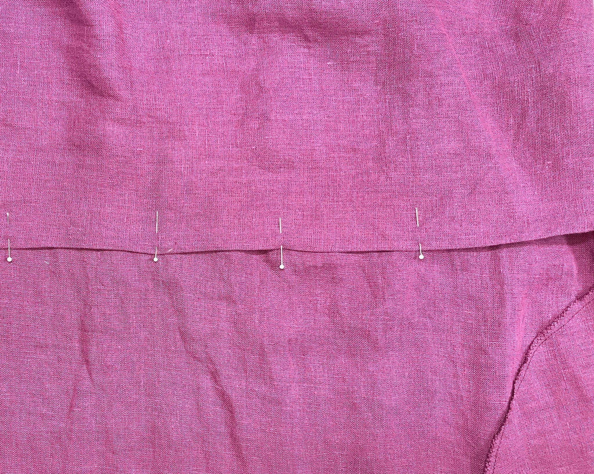 The waistline of the dress lining, pinned to the waistline of the Sauvie Sundress