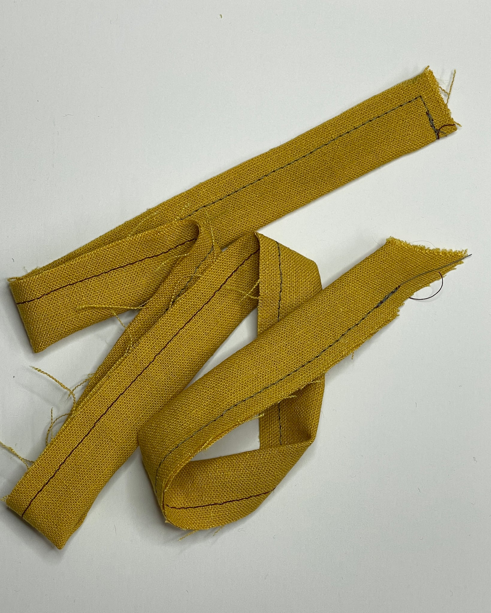 Yellow waist tie, folded in half and stitched at 3/8"