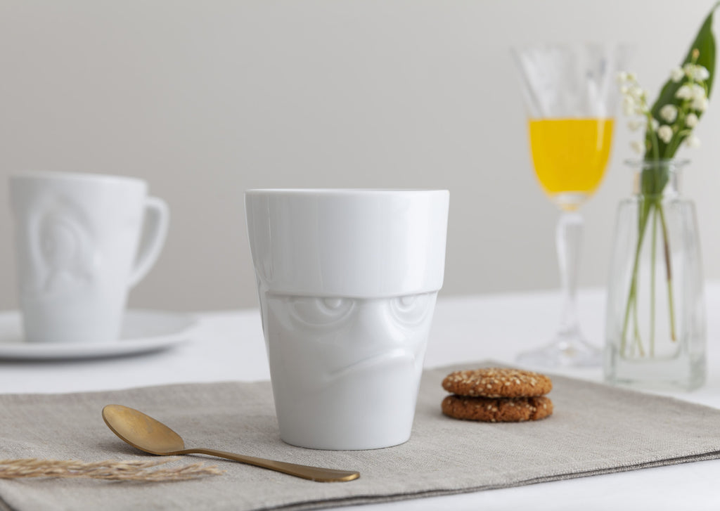 Grumpy expression Coffee Mug by FIFTYEIGHT Products featuring funny faces in premium porcelain.