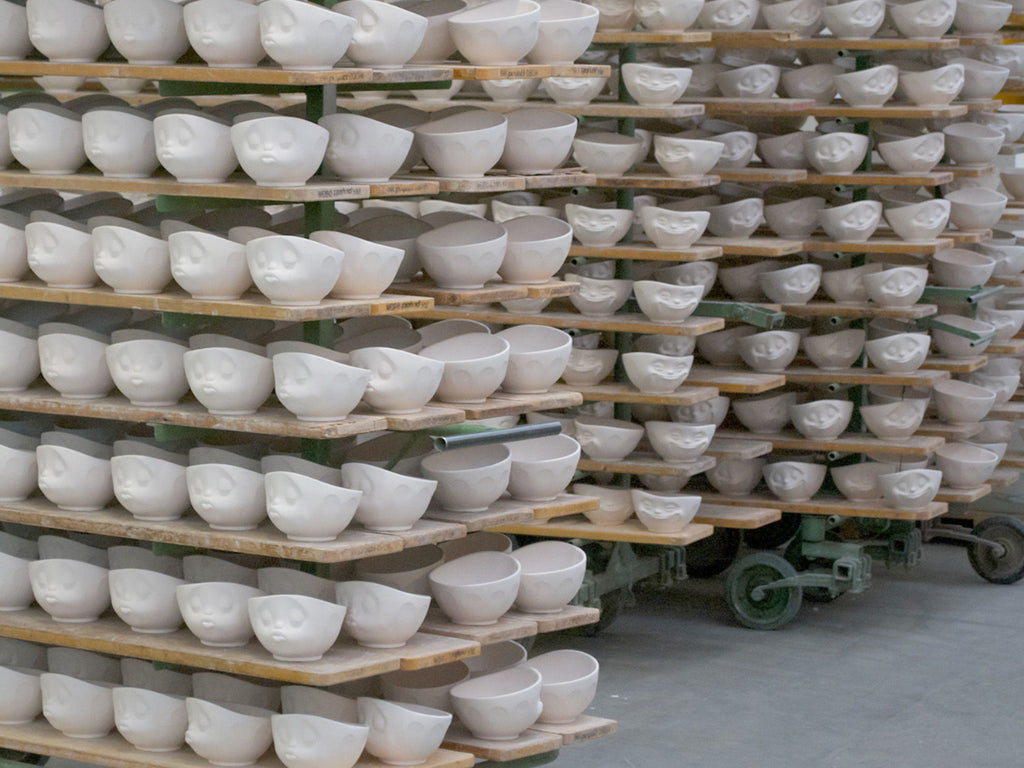 Mixed porcelain bowls by FIFTYEIGHT PRODUCTS, including cereal bowls, salad bowls and small egg cups.