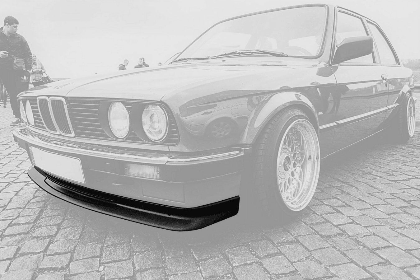Sleek black bwm e30 coupe with detailed front grill on a foggy road on  Craiyon
