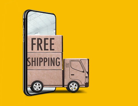 A truck made of cardboard appears to come out from a smartphone screen.