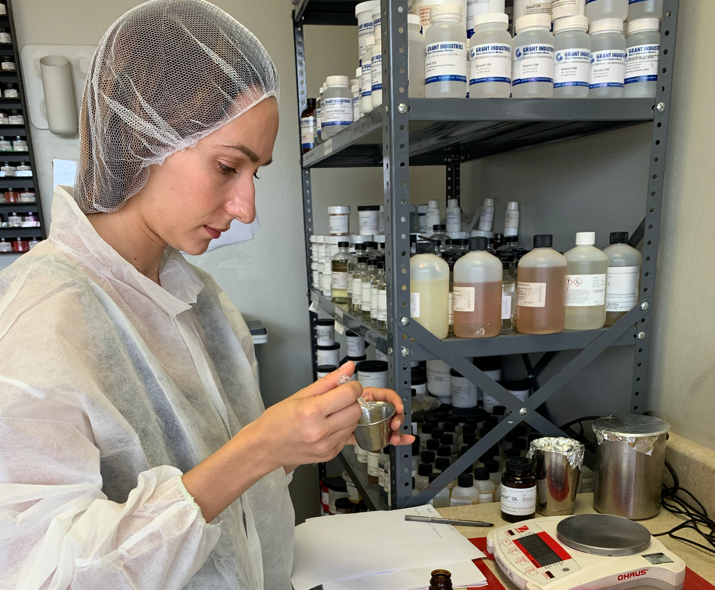 Woman working in a lab on Cosmetic Product Development