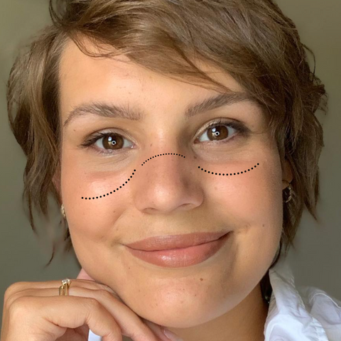 Woman wearing blush over the bridge of her nose for a natural sunburned look