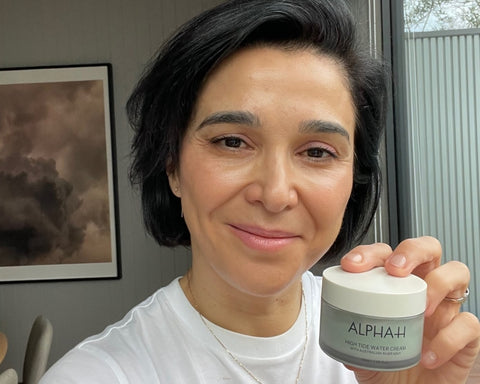 woman holding Alpha-H High Tide Water Cream moisturiser