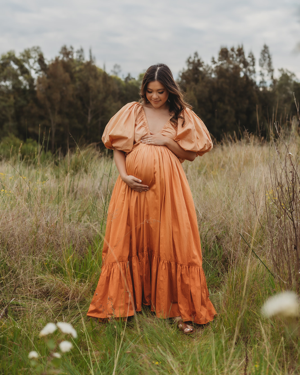Steph wears the Birthday Gown in Orange Ombre for her maternity dress shoot