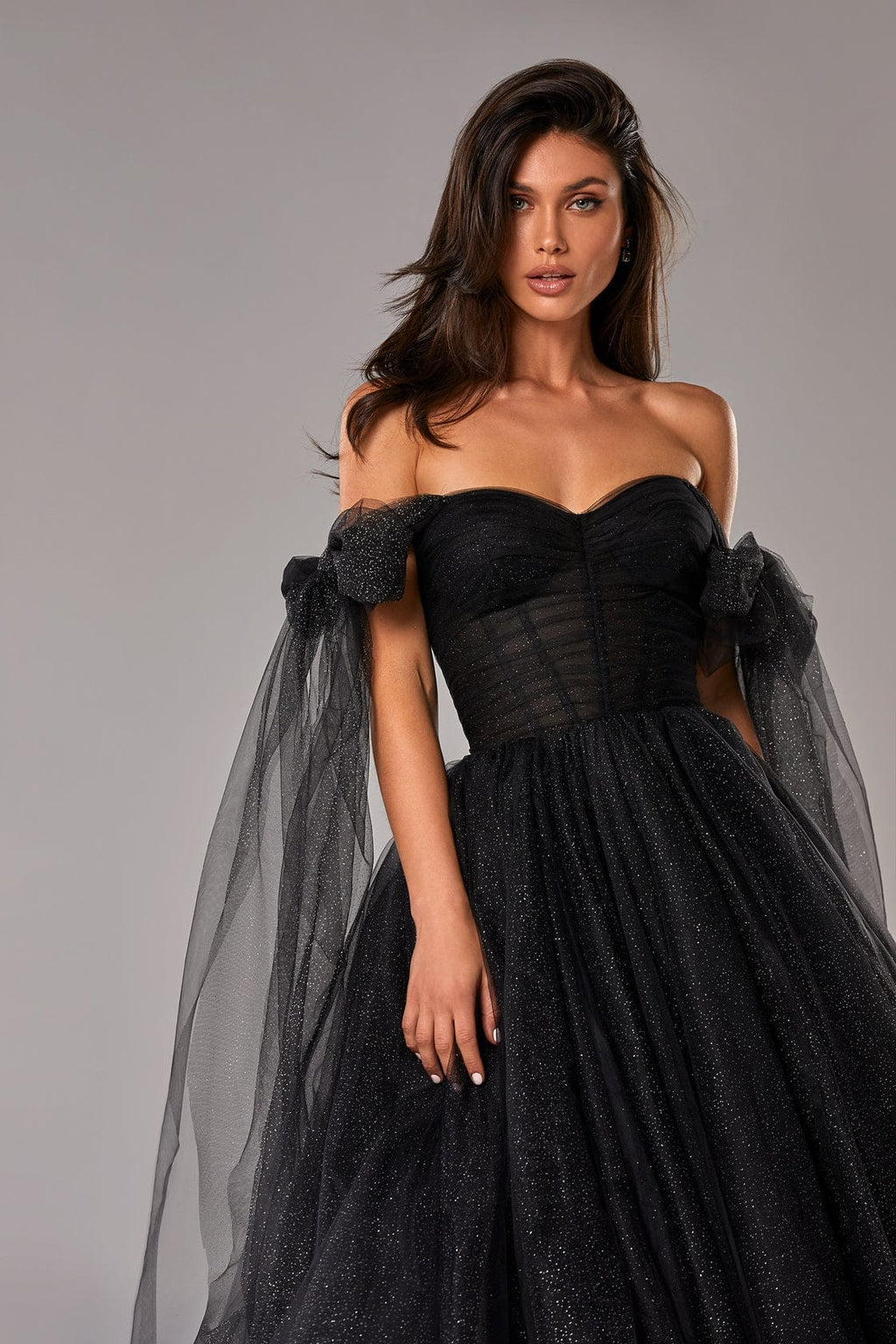 Feminine tulle cocktail dress with the light off-the-shoulder