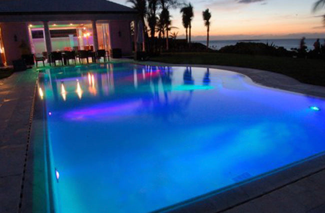 Residential Home Exterior and Pool illuminated with Specialty Lighting