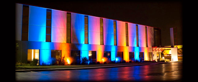 Exterior of building illuminated with colored light