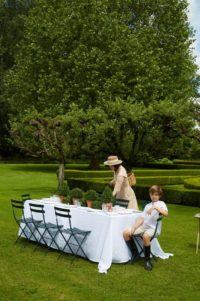 Zoë de Givenchy setting a table in the garden