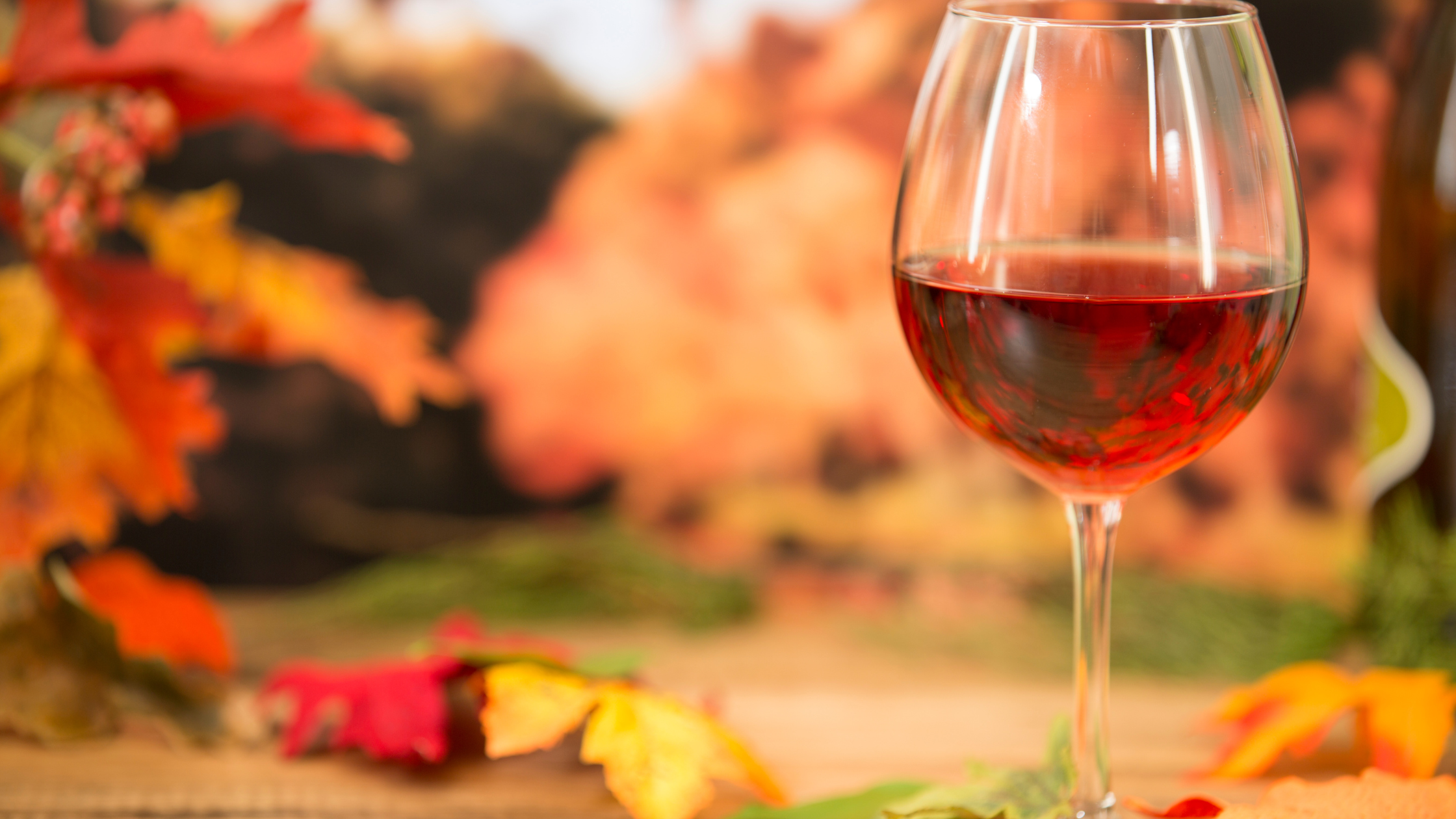 FALL background, glass of red wine