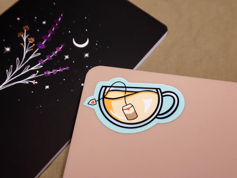 Photo of Journal & Laptop with stickers