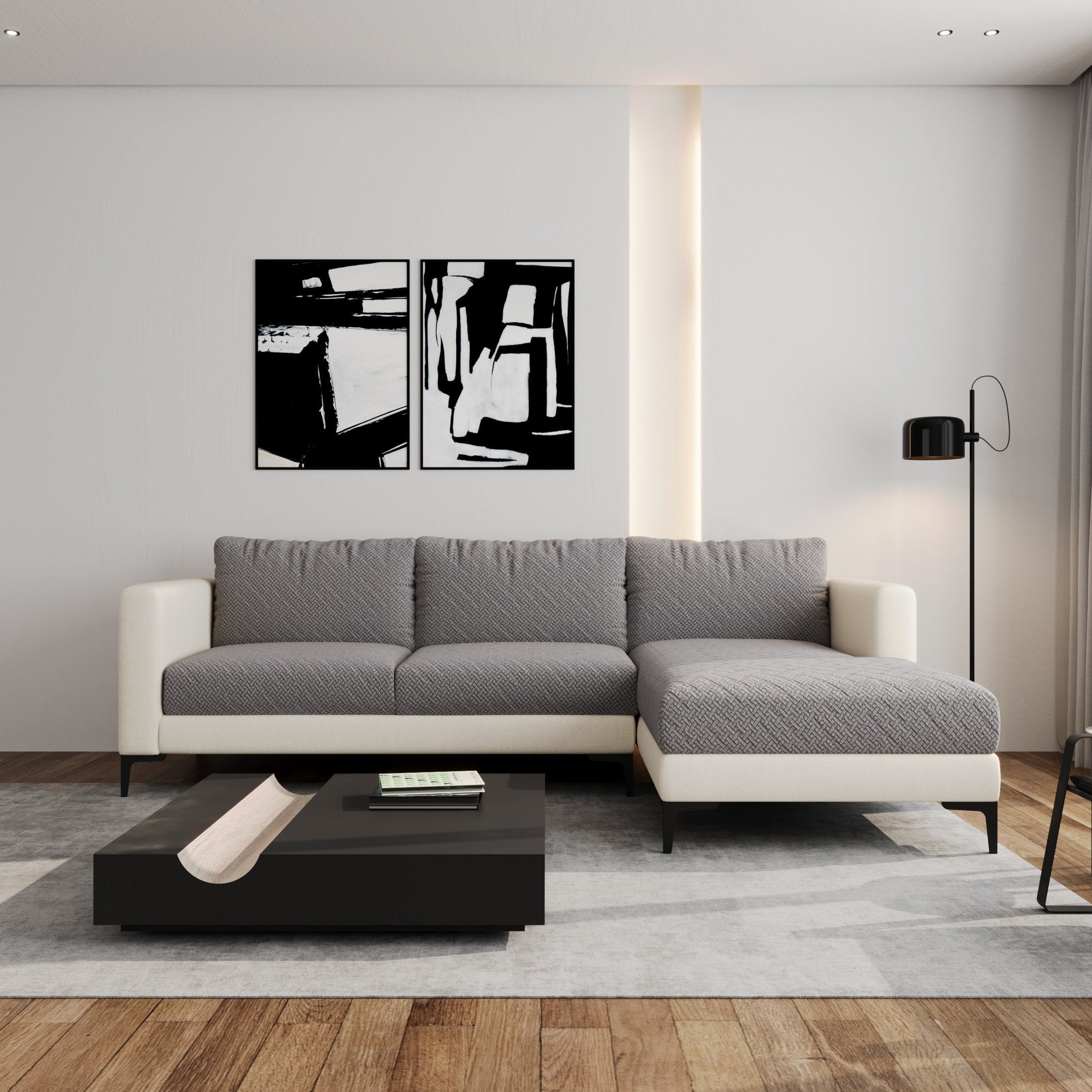 Modern living room with a gray sectional sofa and black abstract wall art.