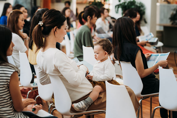 Mom with baby attending