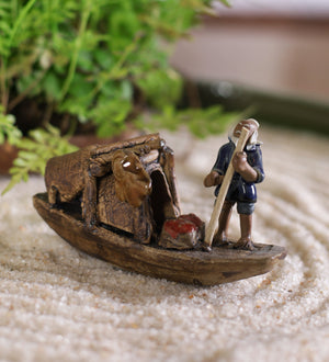 Old fisherman in blue sitting on boat with fishing rod – Gaia Pottery In