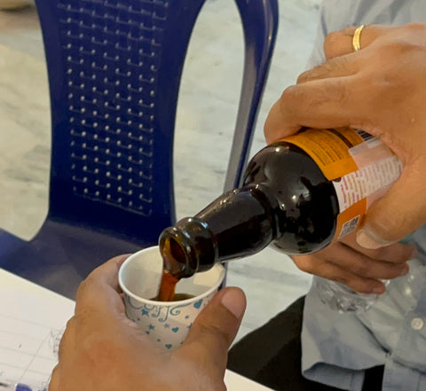 A serving of BONOMI Caramel Mocha Cold Brew Coffee being poured into a tasting cup