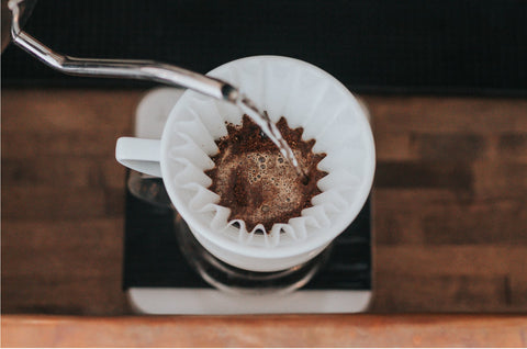 An image of a black coffee being made using the pour over method. Shot by Tyler Nix | Unsplash