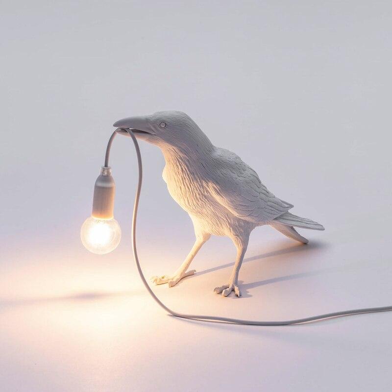 animal holding light bulb lamp