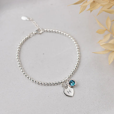 Aquamarine sterling silver birthstone bracelet personalised with initial letter