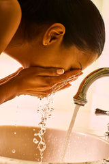 Woman washing face