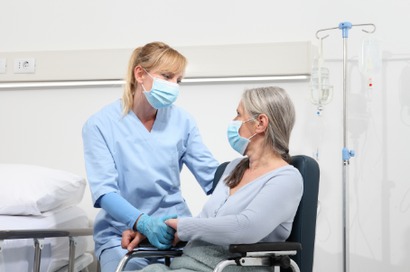 hospital worker with patient