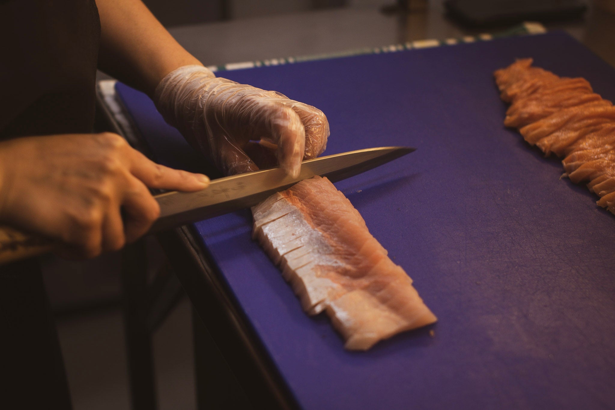 picture of chef using a japanese knife to cut meat