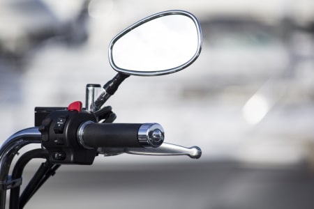 Rearview mirror on a motorized bicycle.