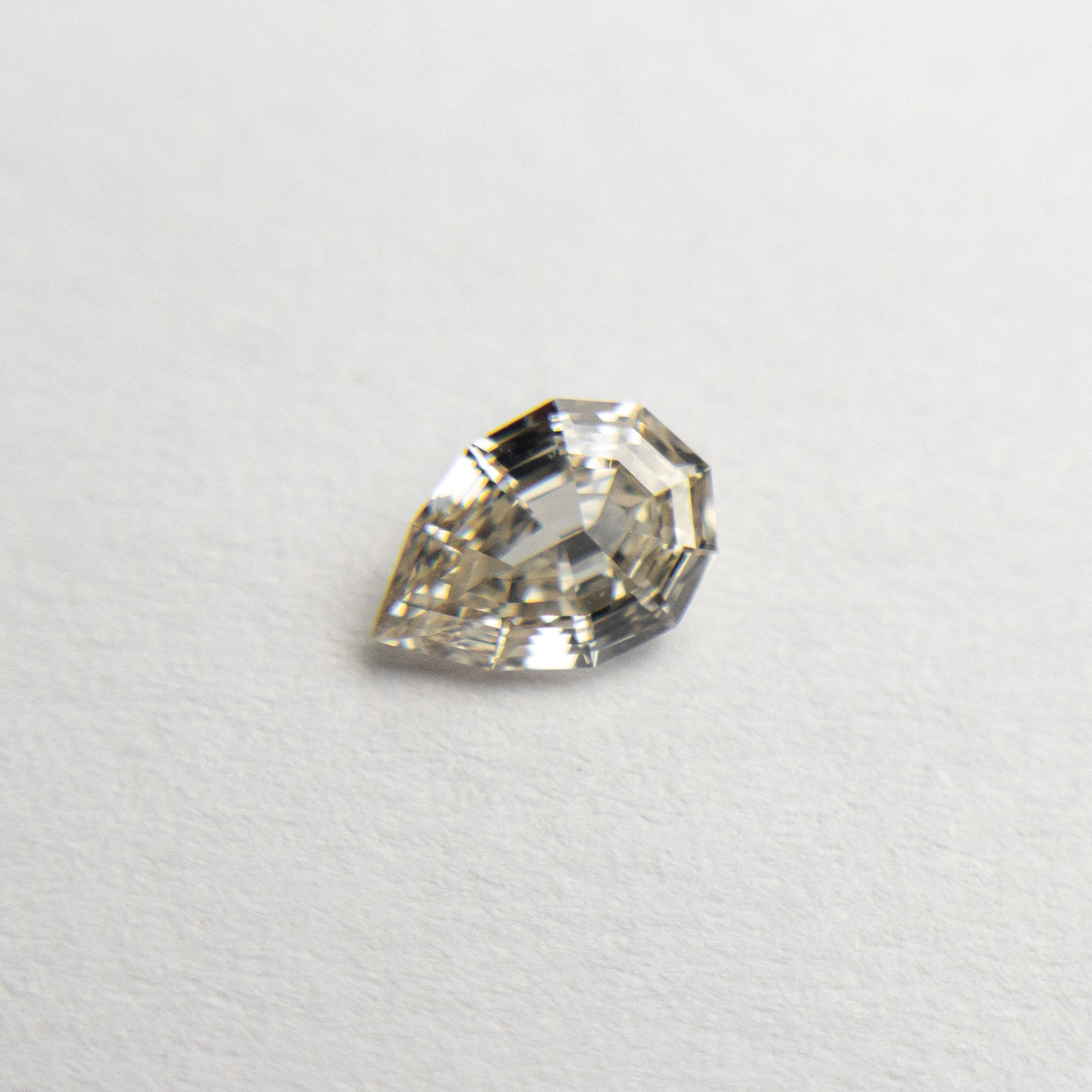 0.28ct 5.51x3.73x1.97mm Geo Pear Step Cut 19163-21