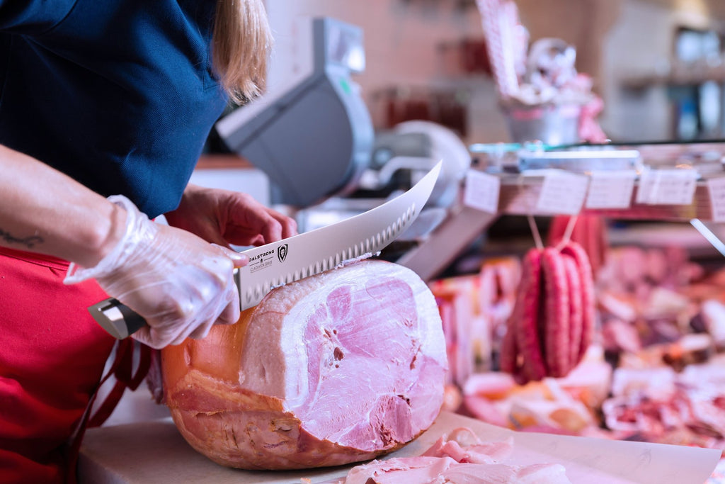 butcher slicing raw meat