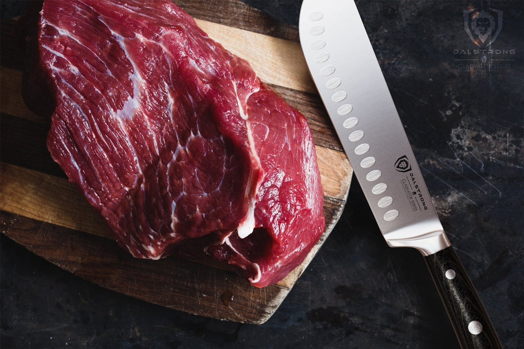 bull nose knife beside chunk of beef