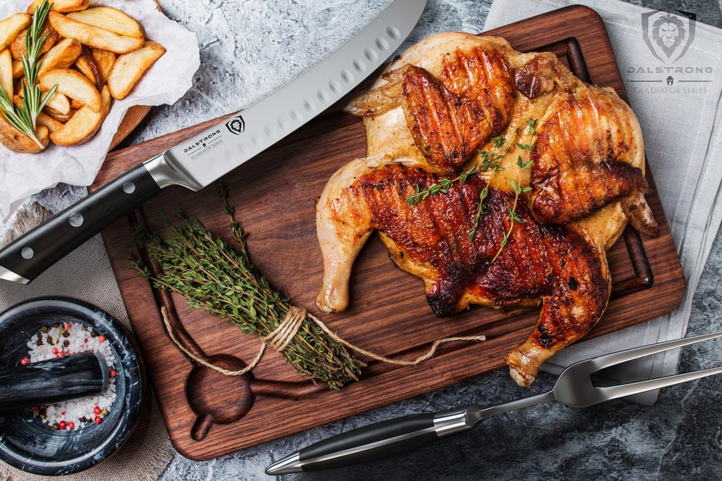 cooked chicken with butcher knife