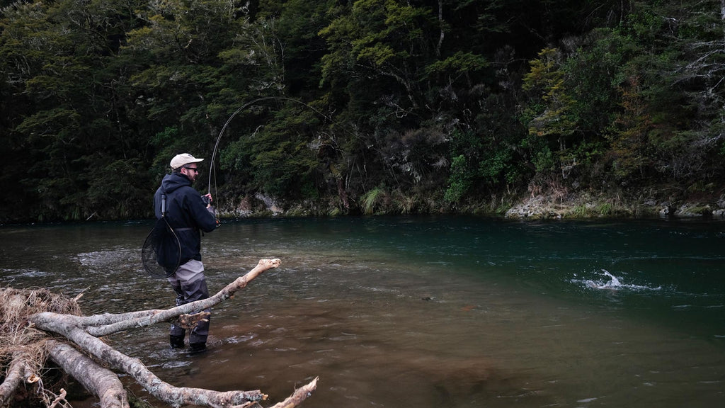 Hooked up to a back country trout in New Zealand