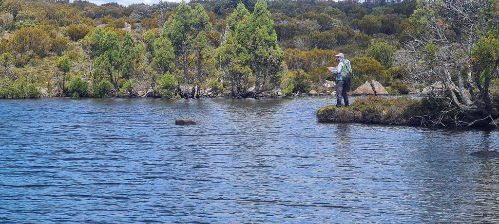 A Fisherman Casting For Trout In Tasmania