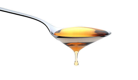 Raw honey in the spoon