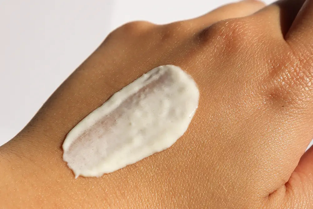 cream on the hand to protect your skin to be beautiful in summer