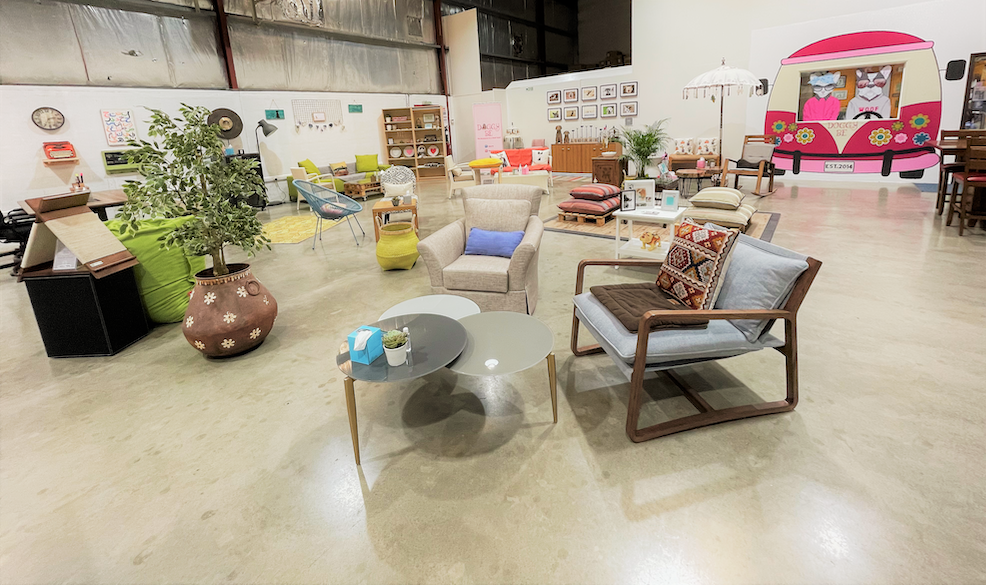 overview of space and furniture in The Doggy Be Collective, with 2 sofa chairs in front