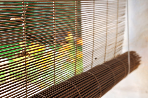 bamboo shades window overlook garden