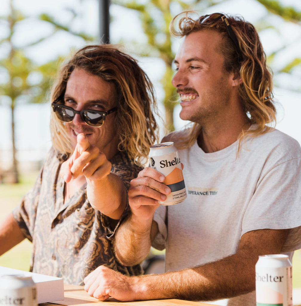 Two people drinking beer in a beer garden