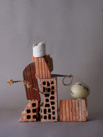 sculpture with ceramic vases, bricks and debris from construction site