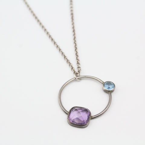 Circular pendant with amethyst and blue topaz