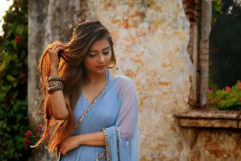 An Indian woman with luscious hair. Using Amla Powder for Hair.
