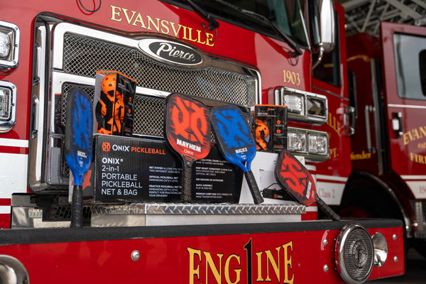 pickleball paddles sitting on a fire truck