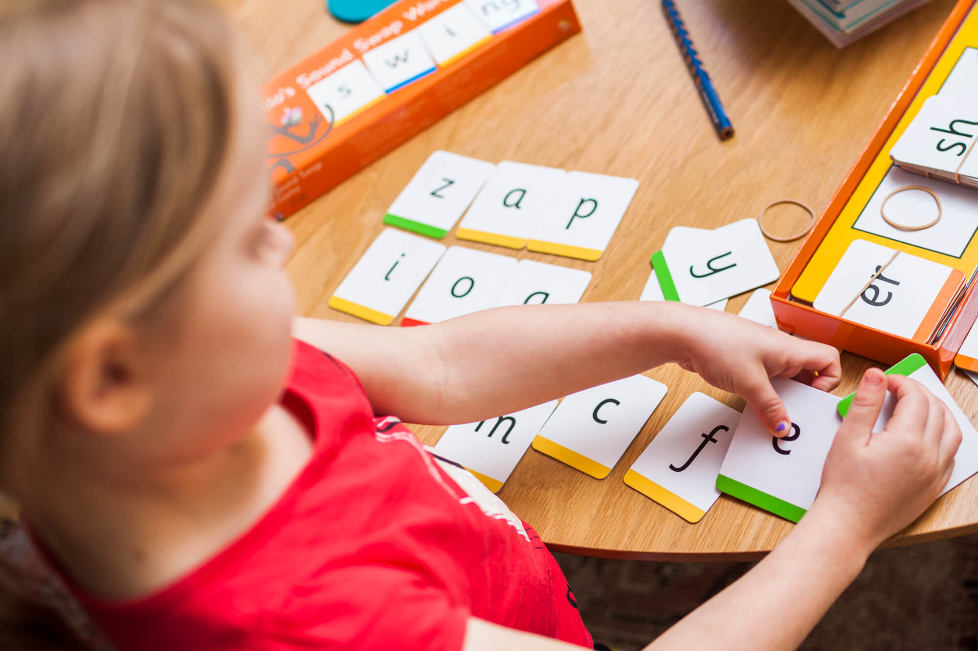 Child using Sound Swap Word game cards