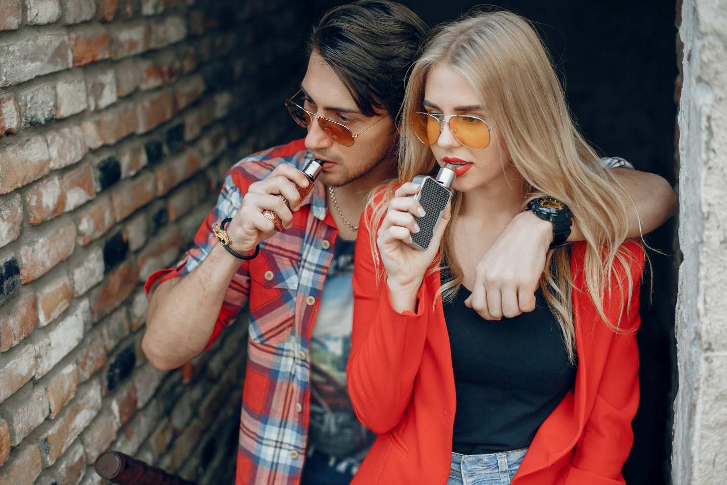A couple vaping together