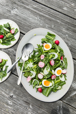 Salt Water Farm dandelion salad on a handmade Sheldon Ceramics Farmhouse Oval Platter