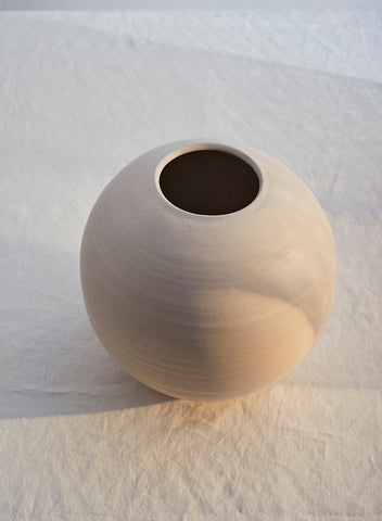 A Sheldon Ceramics handmade moon vase in eggshell glaze. 