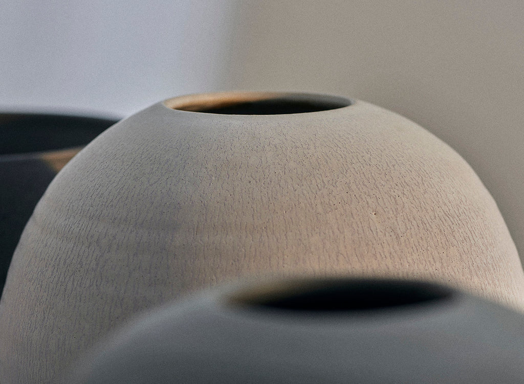 Closeup of a handmade Sheldon Ceramics Moon Vase in Desert Sage. 