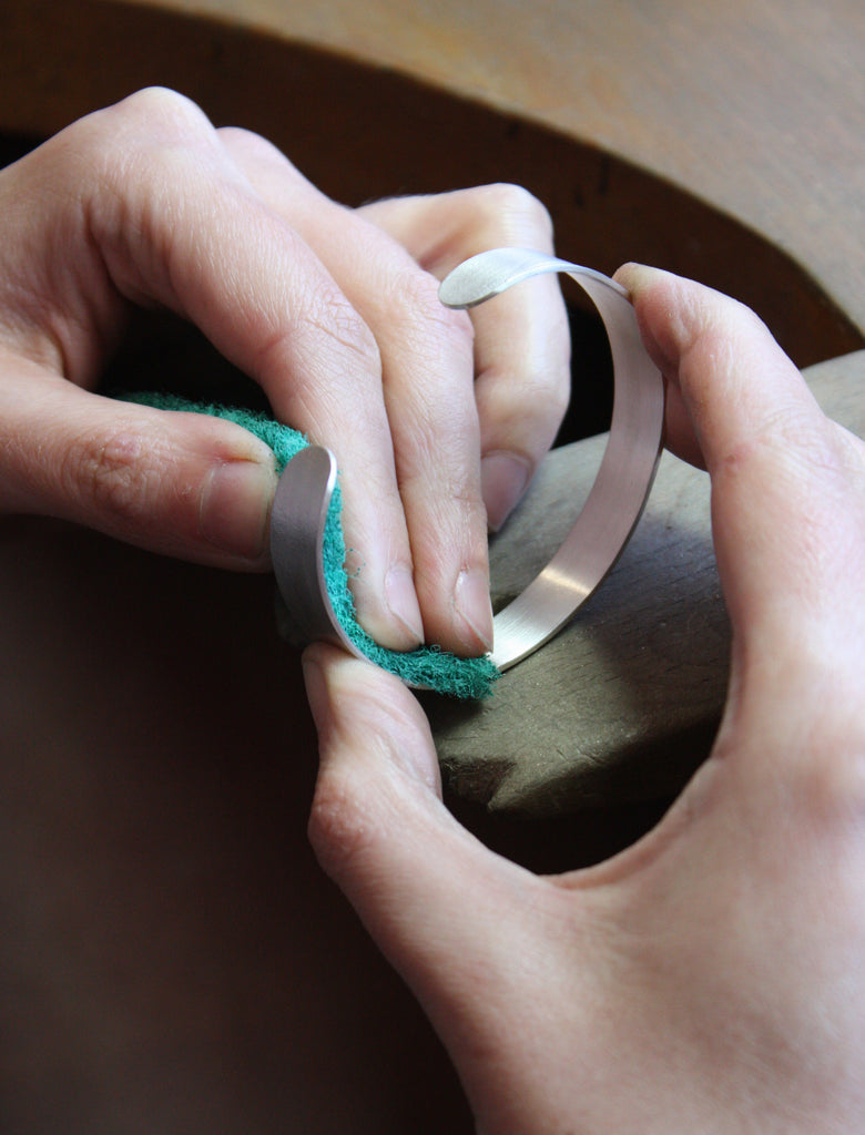 Restore a brushed silver finish on your jewellery by gently rubbing the surface with a dry scotch brite pad.